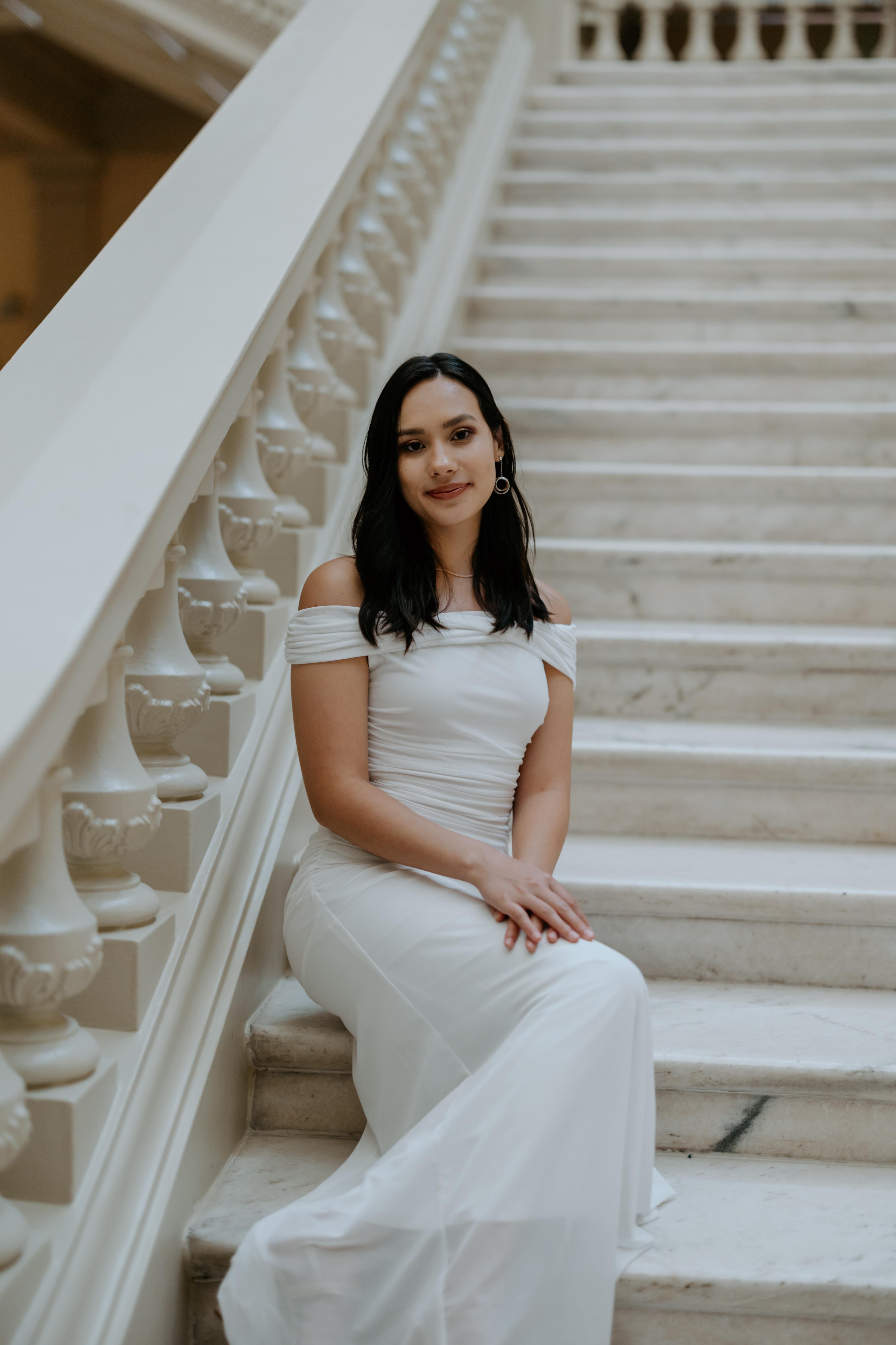 Kayla McGuinn, Founder of Verse Music School, smiling in a warm music studio setting
